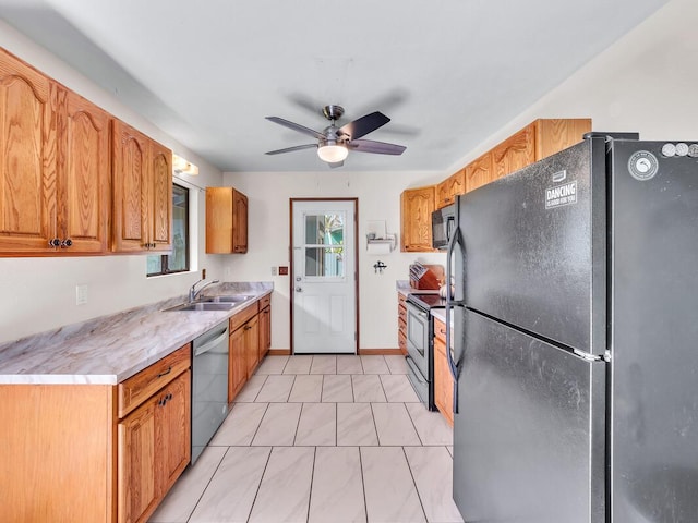 kitchen with light tile patterned floors, sink, ceiling fan, and black appliances