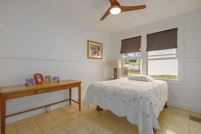 tiled bedroom with ceiling fan