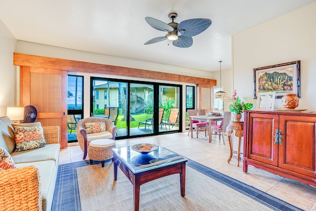 living room featuring ceiling fan and light tile patterned floors