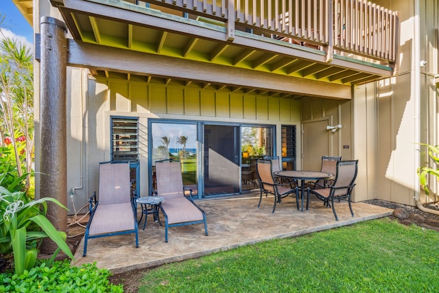 view of patio featuring a balcony