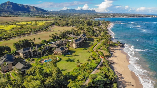 birds eye view of property with a water and mountain view