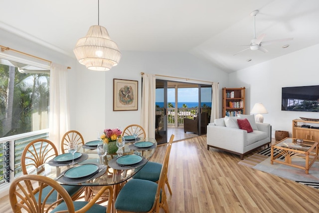 dining room with ceiling fan, light hardwood / wood-style flooring, and lofted ceiling