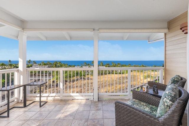 balcony featuring a water view