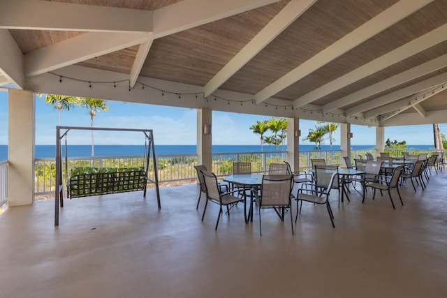 view of patio featuring a gazebo and a water view