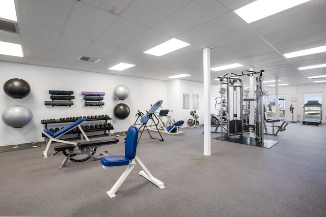 gym featuring a paneled ceiling