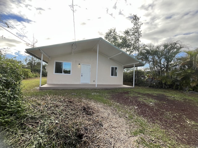 back of property featuring a patio