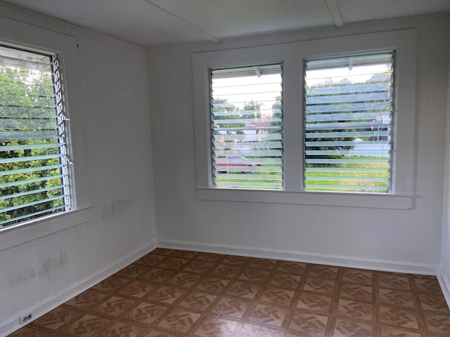 empty room with light parquet flooring