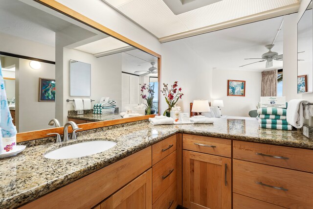 bathroom featuring ceiling fan and vanity