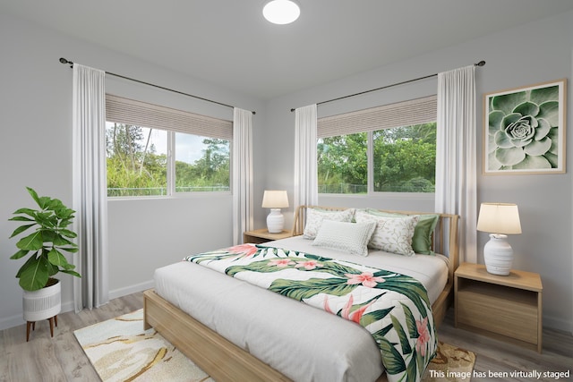 bedroom featuring light wood-type flooring