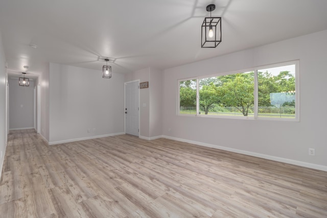 empty room with light hardwood / wood-style floors