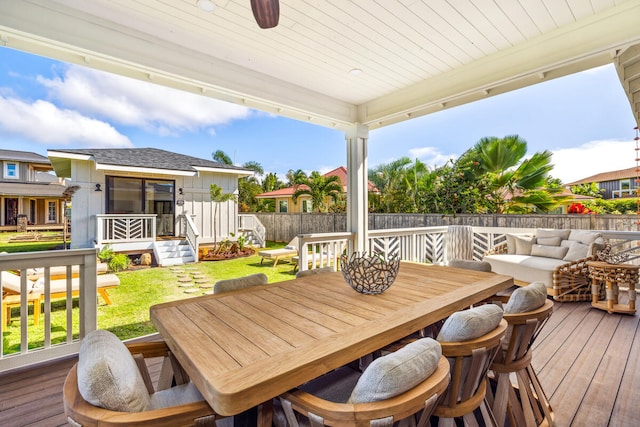 wooden deck featuring outdoor lounge area and a yard