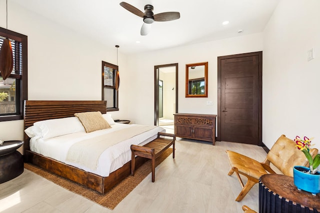 bedroom with ceiling fan and connected bathroom