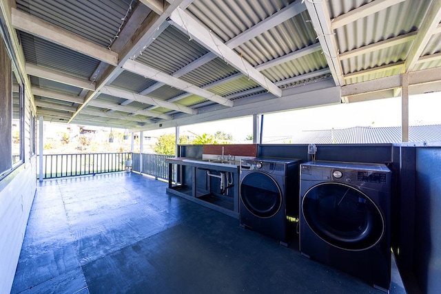 view of patio / terrace with washing machine and clothes dryer