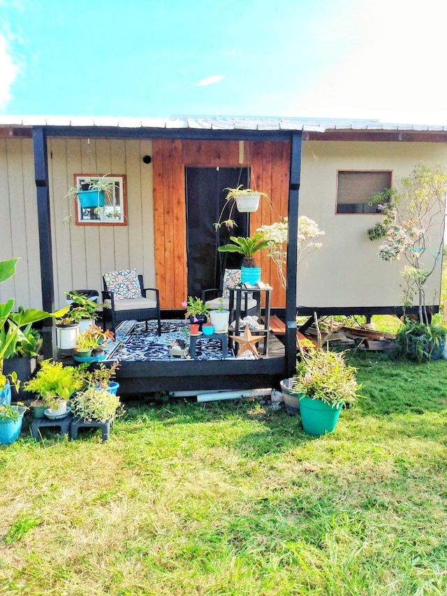 view of outbuilding featuring a yard