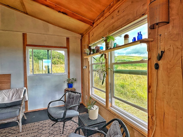 sunroom featuring plenty of natural light, wood ceiling, and vaulted ceiling