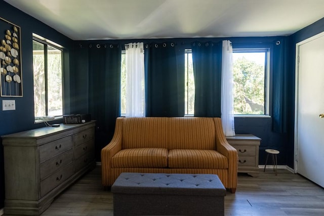 living area with hardwood / wood-style flooring