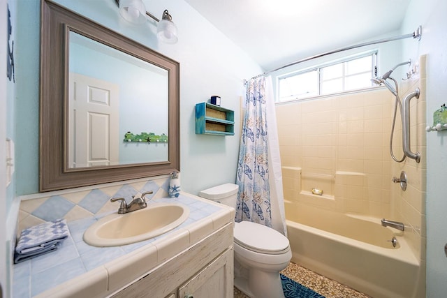 full bathroom with vanity, toilet, and shower / bath combo with shower curtain