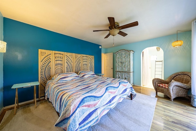 bedroom featuring hardwood / wood-style flooring and ceiling fan