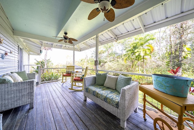 wooden terrace featuring an outdoor hangout area and ceiling fan