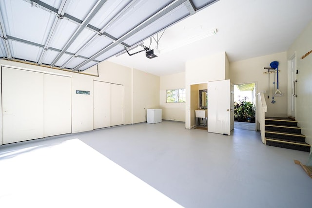 garage with sink and a garage door opener