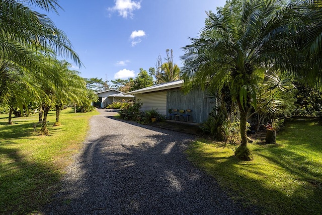 view of home's exterior with a lawn