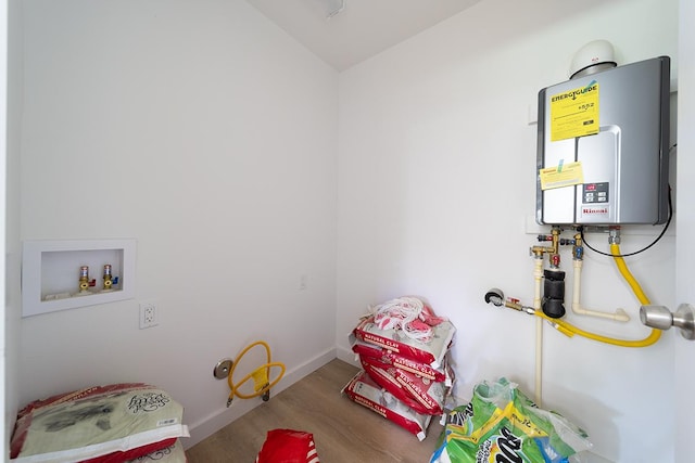 clothes washing area featuring hardwood / wood-style floors, hookup for a washing machine, and water heater