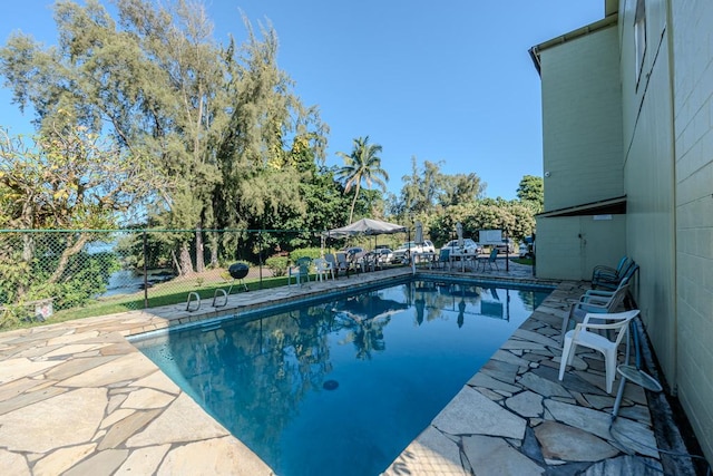 view of swimming pool featuring a patio