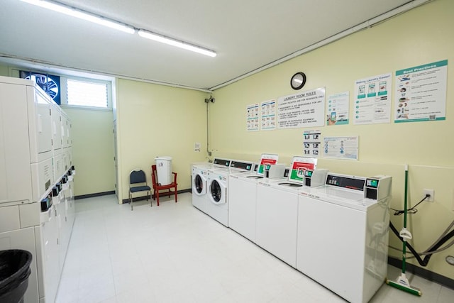 washroom with stacked washing maching and dryer and washing machine and clothes dryer