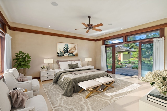 bedroom featuring ceiling fan and access to exterior