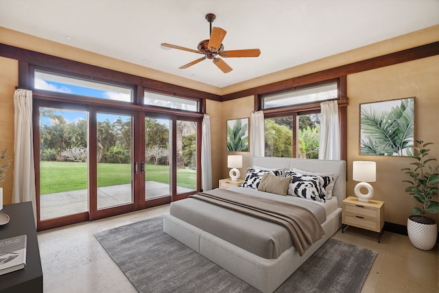 bedroom with ceiling fan, access to exterior, and multiple windows