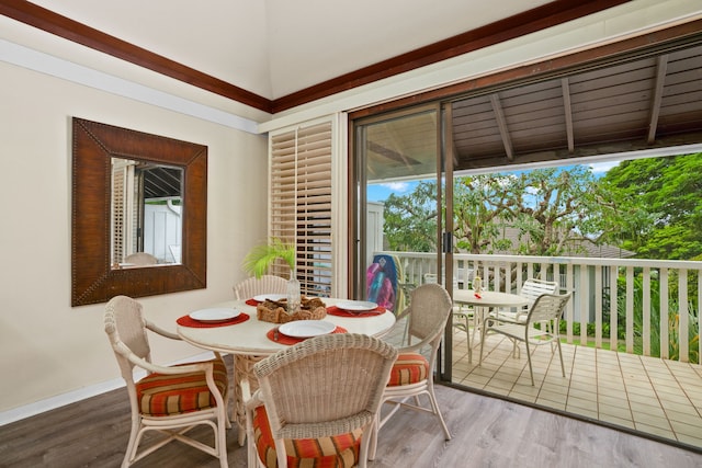 dining room featuring a healthy amount of sunlight and hardwood / wood-style flooring