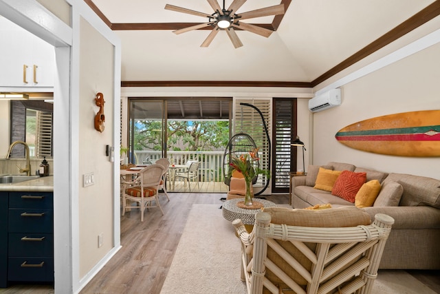 living room with ceiling fan, sink, light hardwood / wood-style flooring, a wall unit AC, and crown molding