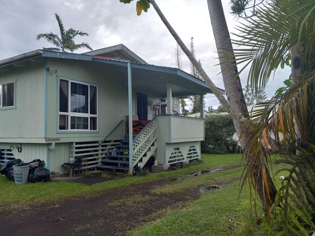 view of home's exterior with a yard