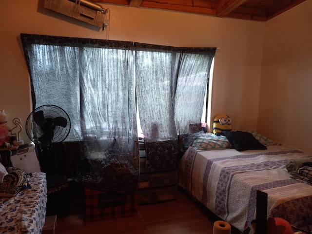 bedroom with hardwood / wood-style flooring