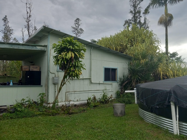 view of home's exterior featuring a lawn