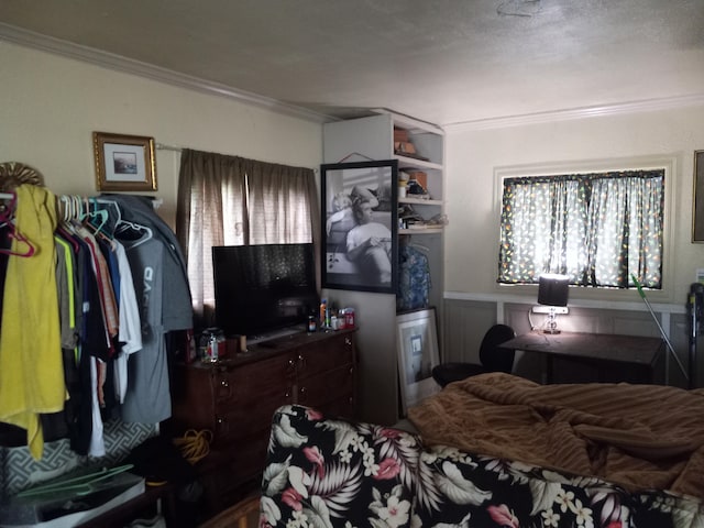 bedroom featuring crown molding