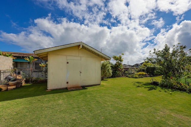 view of outbuilding featuring a lawn