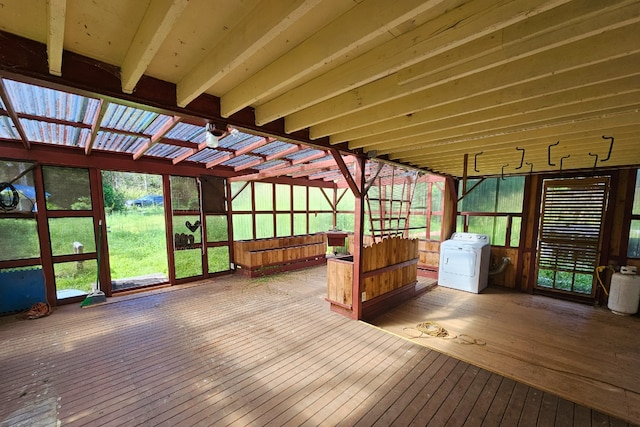 unfurnished sunroom featuring washer / clothes dryer