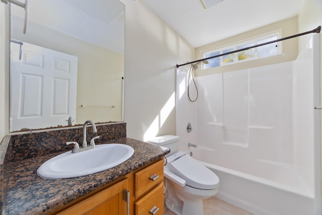 full bathroom featuring tile patterned flooring, vanity, toilet, and shower / washtub combination