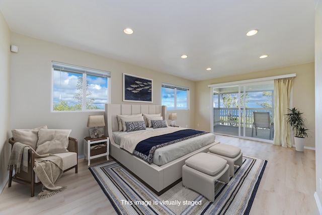 bedroom featuring access to exterior and light wood-type flooring