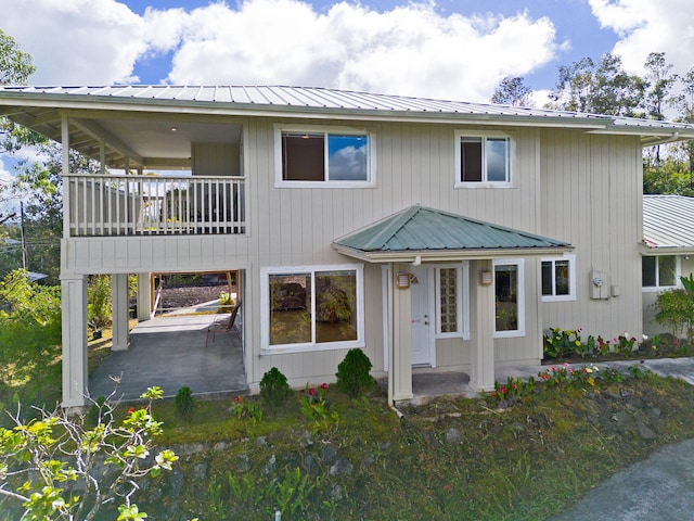 view of front of home with a balcony