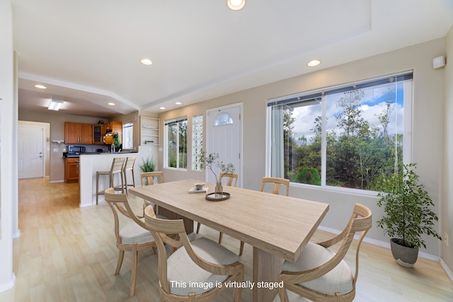 dining space with light wood-type flooring