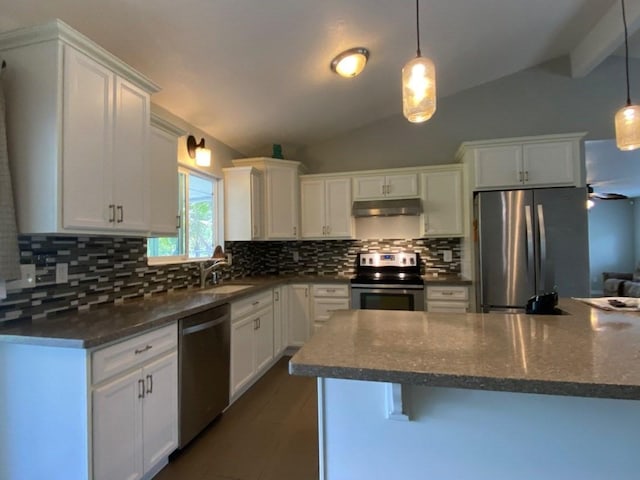 kitchen featuring vaulted ceiling with beams, hanging light fixtures, white cabinets, and stainless steel appliances