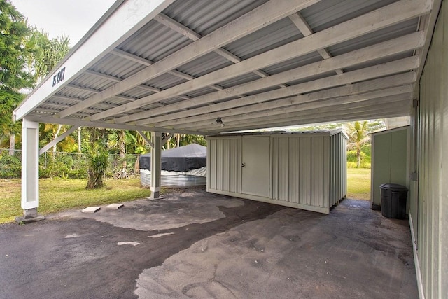 view of vehicle parking featuring a carport