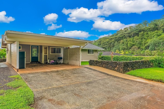 view of front of home featuring a carport