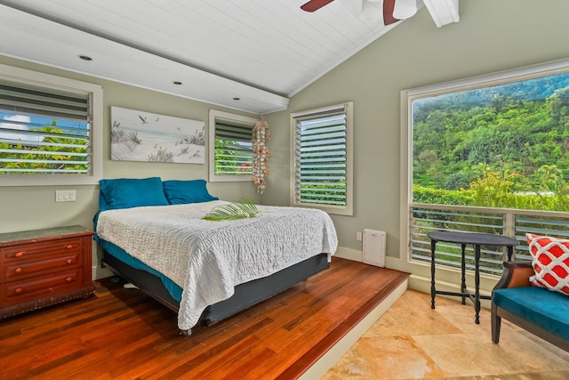 bedroom featuring wood-type flooring, vaulted ceiling, ceiling fan, and wooden ceiling