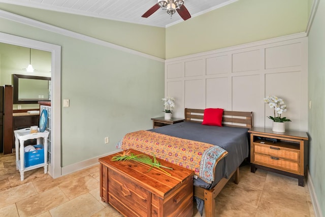 bedroom featuring ceiling fan, ornamental molding, and vaulted ceiling