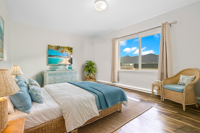 bedroom with hardwood / wood-style flooring