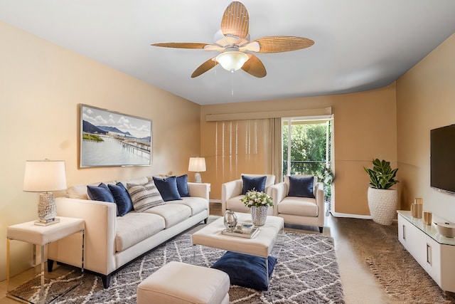 living room with dark carpet and ceiling fan