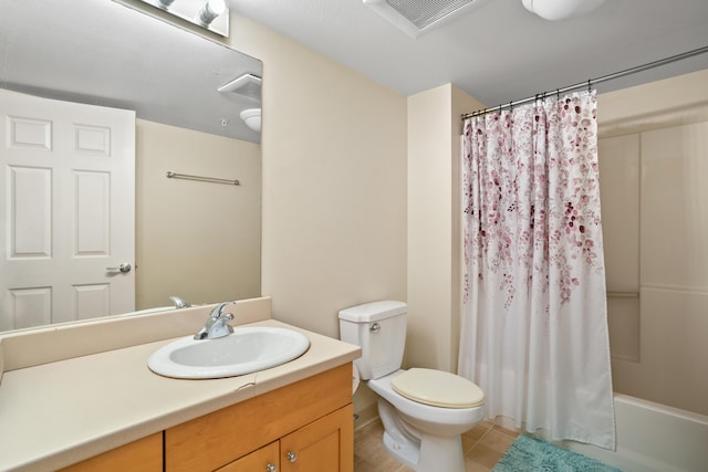 full bathroom featuring shower / tub combo, vanity, toilet, and tile patterned flooring